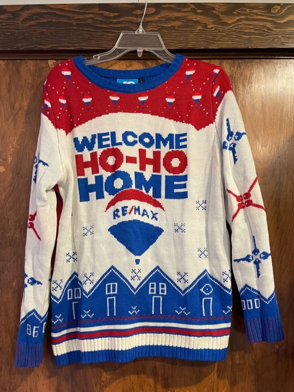 'Welcome Ho-Ho Home' Holiday Sweater - White/Red/Blue Remax logo